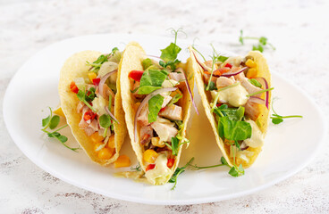 Mexican tacos with chicken meat, corn and salsa. Healthy tacos. Diet menu. Mexican taco.