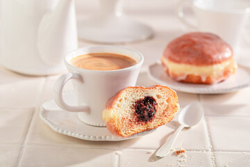Sweet and hot doughnuts served with coffee.