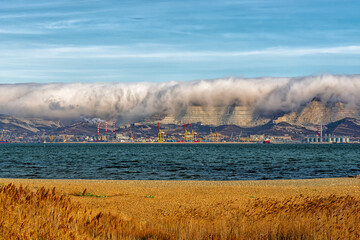 Fototapeta na wymiar Creeping clouds on the eastern shore of Tsemes Bay in Novorossiysk