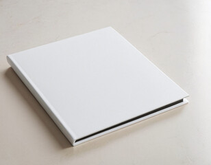 Fototapeta premium Minimalist white photo album on a light surface creating a clean and elegant visual aesthetic.