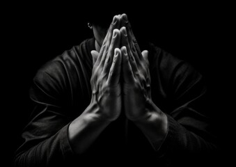 Praying hands in black background - obrazy, fototapety, plakaty