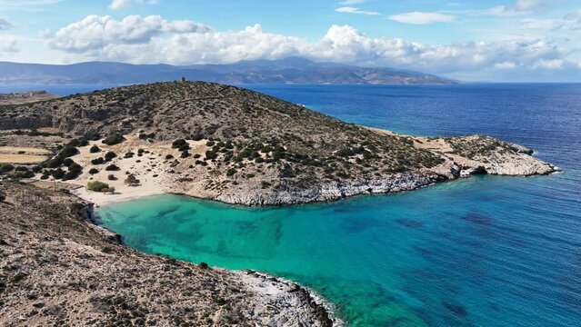 Aerial drone video of paradise secluded beach of Psili Amos in small island of Schoinousa, Small Cyclades, Greece