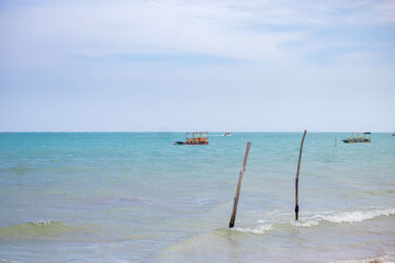 Beach sun heat coconut water beach, sea water umbrella boat, tables chairs, your vacation sun and heat