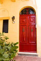 Typical elegant red door in Maltese villages - 732699565