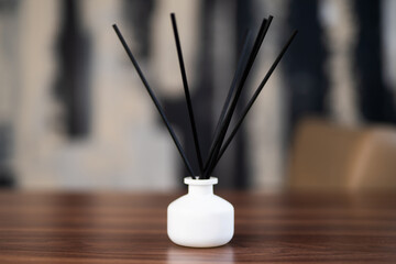 incense sticks in a vase on the table