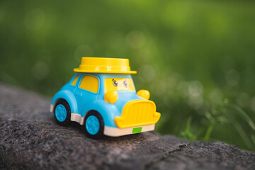 children's plastic toy car with eyes on the playground