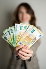 business lady holds euro bills in her hands
