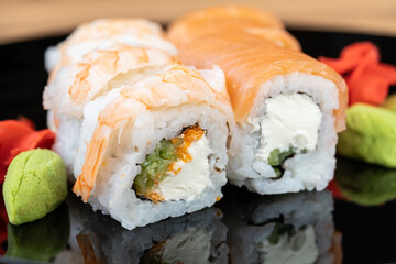 delicious traditional Japanese sushi and rolls on a plate