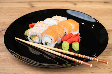 delicious traditional Japanese sushi and rolls on a plate