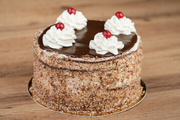 delicious fresh sweet cake with cream and cherry