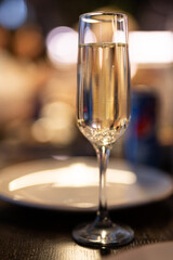 a glass of champagne on the festive table