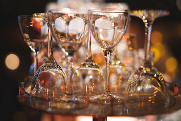 empty clean glass glasses for alcoholic drinks in a restaurant on a bar counter