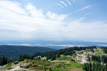 Naklejka premium The view from the Grouse Mountain chairlift with Vancouver in the distant background.