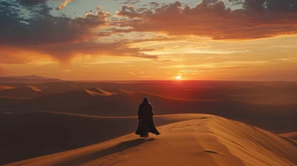 Crédence de cuisine en verre imprimé Chocolat brun Silhouette of a Muslim woman in the desert at sunset. Lone figure, cloaked in desert robes and a distinctive helmet, traversing a vast dune landscape with a sunsetting behind.