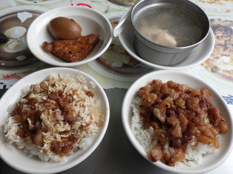 KAOHSIUNG, TAIWAN - January 1, 2024 :Chicken rice, pork rice, soup, and side dishes that I ate in Kaohsiung, Taiwan