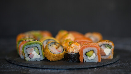 Sushi rolls are served on a plate. soy sauce. Delicious seafood food.