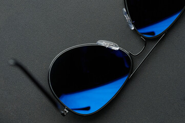 Black sunglassess with blue tint