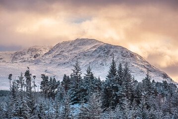 A view of snow-capped Stob Coire Sgriodain, a mountain in the Scottish Highlands (as seen from Laggan Dam)