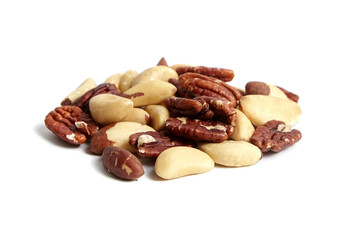 Brazil nuts and peeled pecans mix isolated on white background. Wholesome variety of nuts in a heap