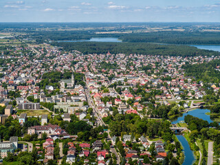 Augustow city by Netta river and Necko lake aerial landscape under blue sky