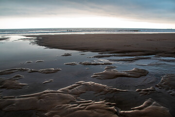 Low tide on the beach in the evening, Normandy, France.
