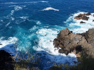 waves crashing on rocks