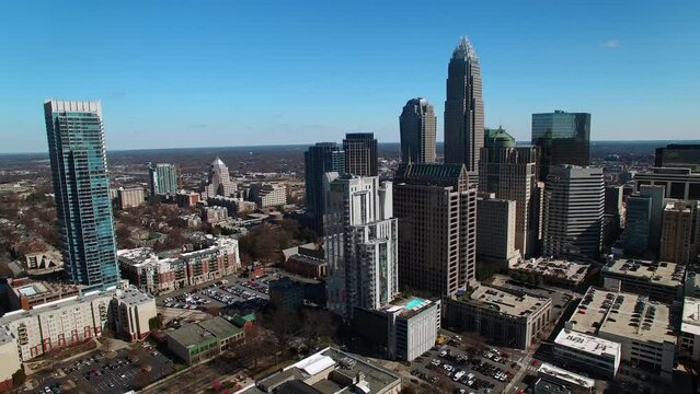 Aerial Panning Shot Of Office Buildings In Modern Downtown District On Sunny Day - Charlotte, North Carolina