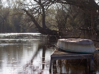 Abandoned boat on the bank - 732737759