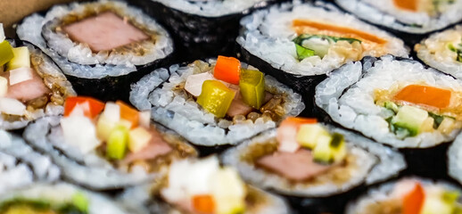 Sushi Roll Platter on wood background. Salmon sushi set, serving food for restaurant, menu, advert or package, close up, selective focus