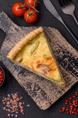 Delicious crispy quiche cut into slices with cheese, broccoli, tomatoes