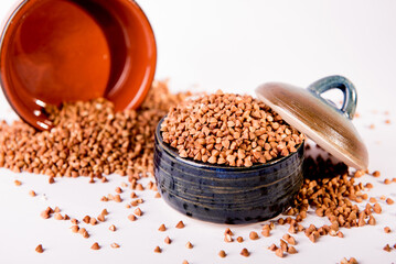 Bowl with raw uncooked buckwheat, Raw Buckwheat Pile, Dry Buck Wheat Grains, Uncooked Buckwheat