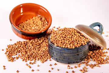 Bowl with raw uncooked buckwheat, Raw Buckwheat Pile, Dry Buck Wheat Grains, Uncooked Buckwheat