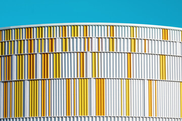 Modern architecture. Close up of blue and yellow building.