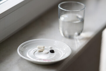 Pill box with variety of pills and supplement, pill organizer