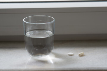 pills and glass of water. Medicine pharmacy health