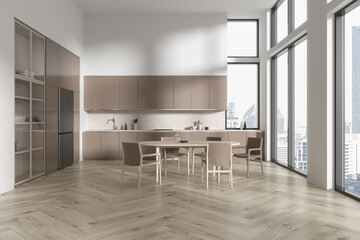 Modern home kitchen interior with cabinet and eating table, panoramic window