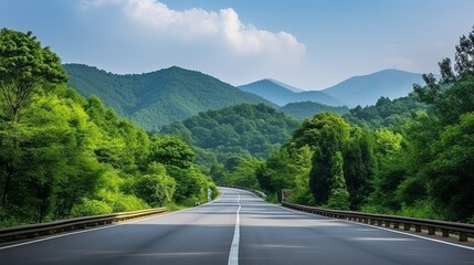 Asphalt road and green forest with mountain nature landscape in Hangzhou, China.