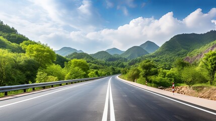 Fototapeta premium Asphalt road and green forest with mountain nature landscape in Hangzhou, China.
