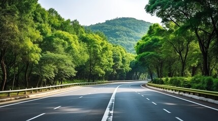 Asphalt road and green forest with mountain nature landscape in Hangzhou, China.