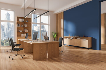 Fototapeta premium Modern office interior with work desk and window. Mock up wall