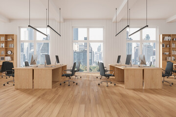 Stylish coworking interior with desk and shelf, workplace near panoramic window