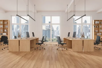  Stylish coworking interior with desk and shelf, workplace near panoramic window © ImageFlow