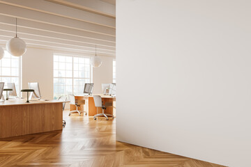 White open space office corner with blank wall