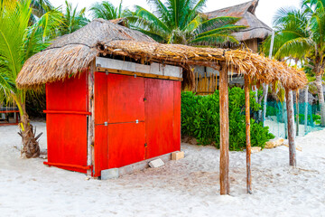 Houses huts wooden cottage in tropical jungle beach palm Mexico.