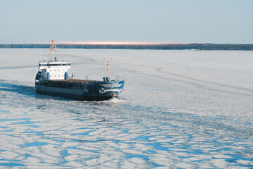 General Cargo Ship Sailing Underway In The Frozen International Shipping Fairway Route. Water...