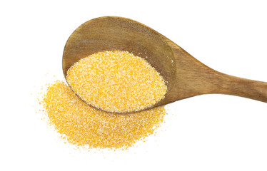 Corn polenta pile in wooden spoon, uncooked isolated on white, top view
