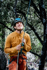 Fototapeta premium Vertical picture of one climber holding security rope from another team member