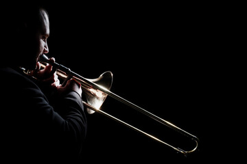 Trombone player. Trombonist playing brass instrument