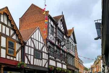 Picturesque half timber frame buildings and a historic clock on the popular and touristic High...