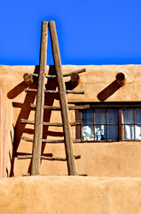 Ladders metaphorically connect to ancestors, universe and spiritual beliefs, Sky City, Acoma Pueblo, New Mexico 